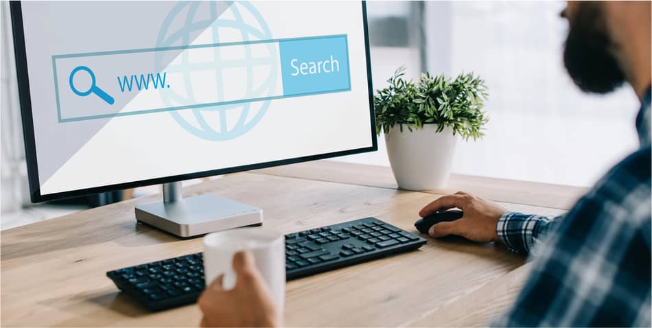 img - cropped-shot-seo-manager-cup-coffee-using-computer-website